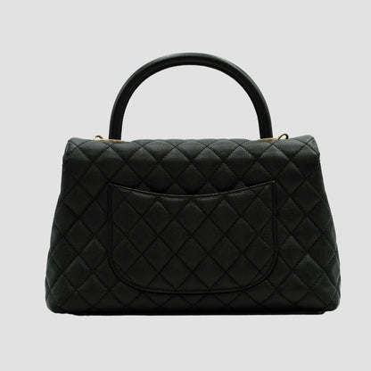 CHANEL Black Quilted Caviar Large Coco Top Handle Pale Gold Hardware